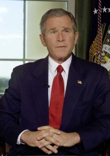 George W. Bush (Portrayal by Aaron Eckhart)