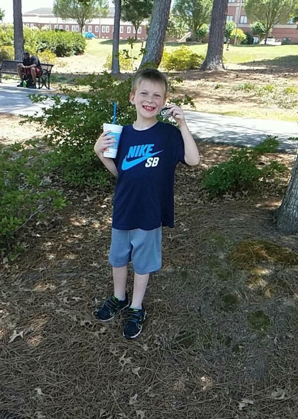 Caiden Dedrick collecting rock